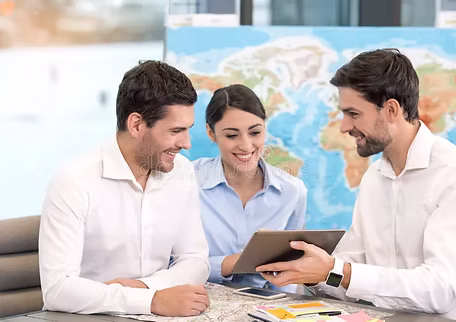 Travelers reviewing a world map while planning a personalized journey