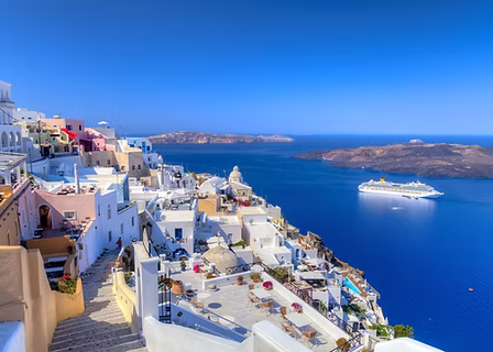 A whitewashed hillside town overlooking the sea