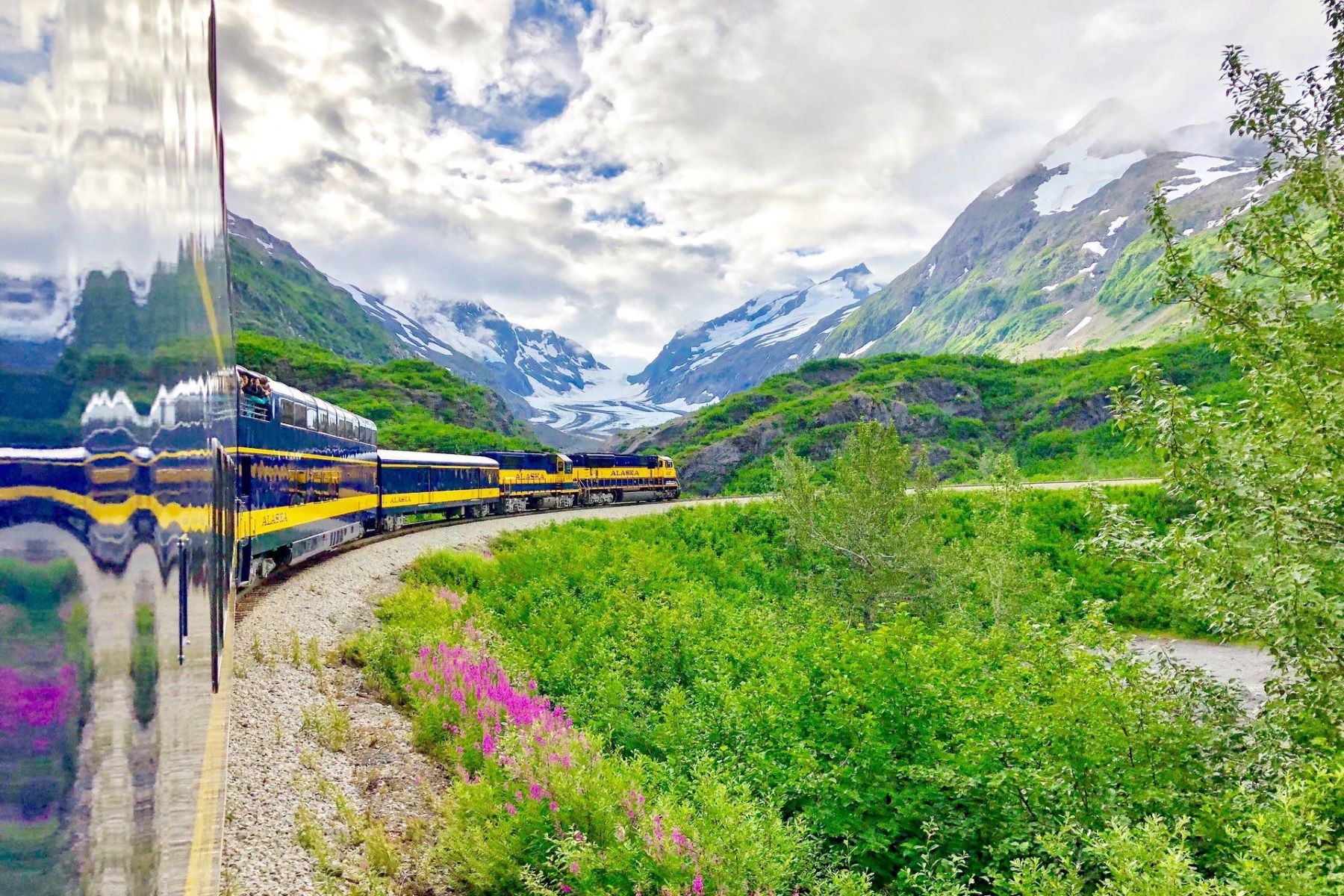 The Alaska Railroad Coastal Classic winding past glaciers and green mountainsides